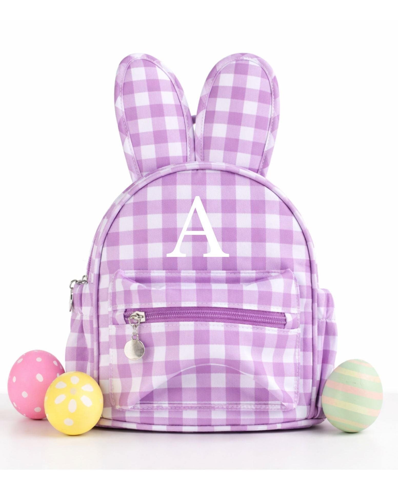 Purple gingham backpack with bunny ears and colorful eggs on a white background
